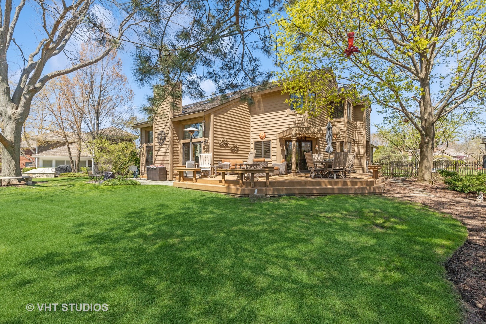 770 Valley Road Lake Forest, IL 60045 - Photo 24 of 29 a view of a house with backyard and a tree