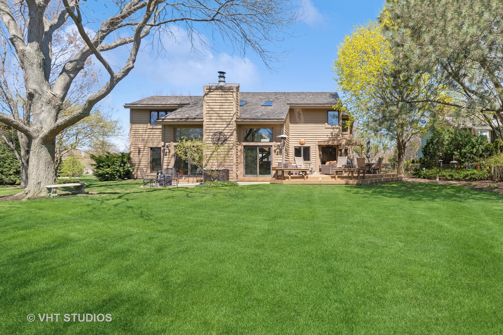 770 Valley Road Lake Forest, IL 60045 - Photo 25 of 29 a view of a house with a big yard and large trees