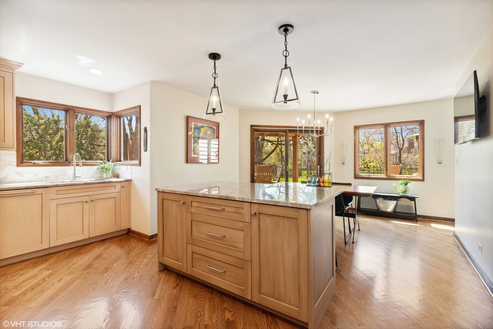 770 Valley Road Lake Forest, IL 60045 - Photo 7 of 29 a large kitchen with sink a refrigerator and white cabinets next to a window