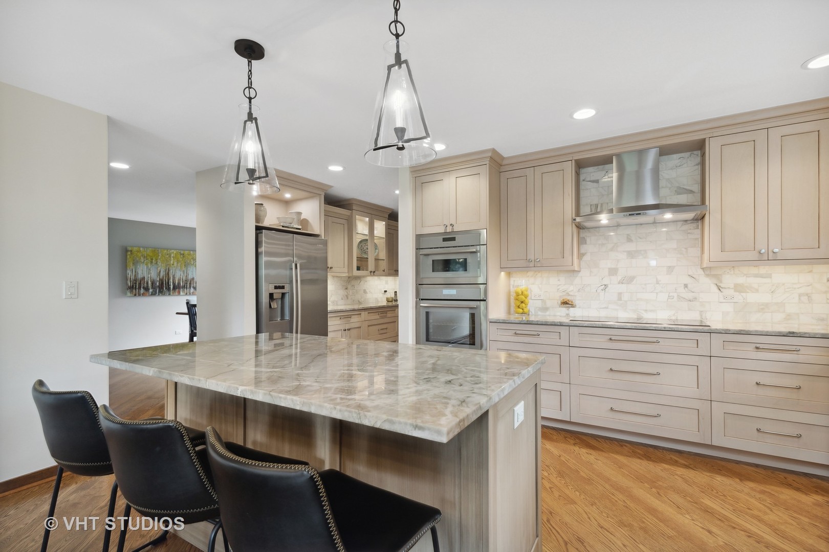 770 Valley Road Lake Forest, IL 60045 - Photo 8 of 29 a kitchen with granite countertop a table chairs stove and refrigerator
