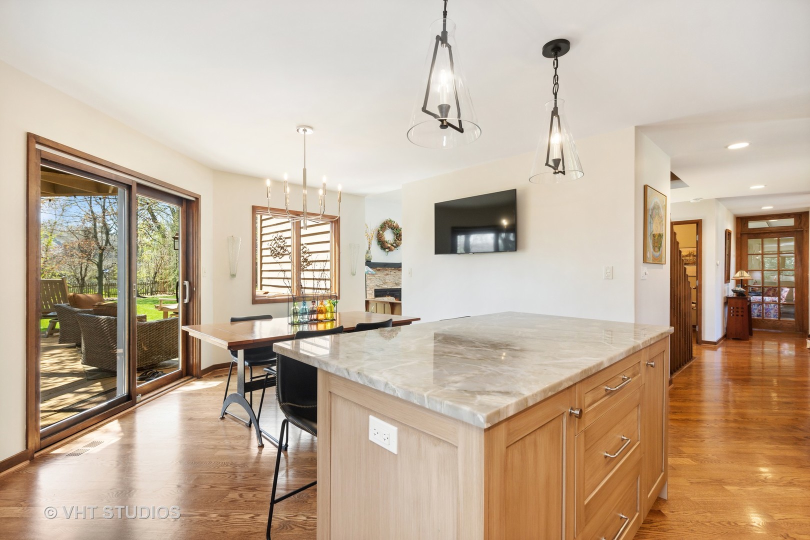 770 Valley Road Lake Forest, IL 60045 - Photo 10 of 29 a view of a kitchen counter top space with furniture wooden floor a chandelier