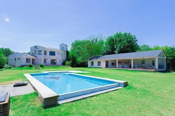 a view of a house with a big yard
