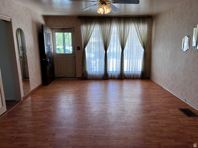 338 South 300 West Helper, UT 84526 - Photo 5 of 20 Entrance foyer with ceiling fan, dark wood-type flooring, and arched walkways
