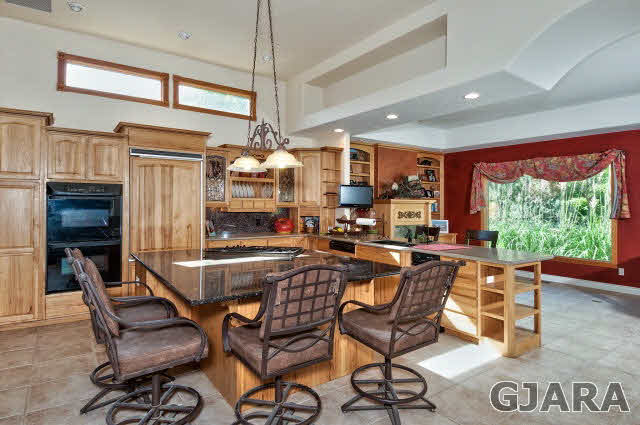 887 25 Road Grand Junction, CO 81505 - Photo 11 of 42 a dining area with furniture and a large window