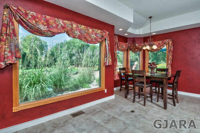 887 25 Road Grand Junction, CO 81505 - Photo 13 of 42 a view of a dining room with furniture window and outside view