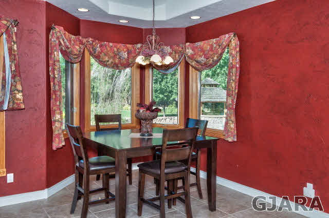 887 25 Road Grand Junction, CO 81505 - Photo 14 of 42 a view of a dining room with furniture window and outside view