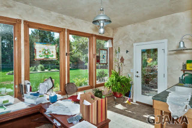 887 25 Road Grand Junction, CO 81505 - Photo 15 of 42 a living room filled with furniture and a large window