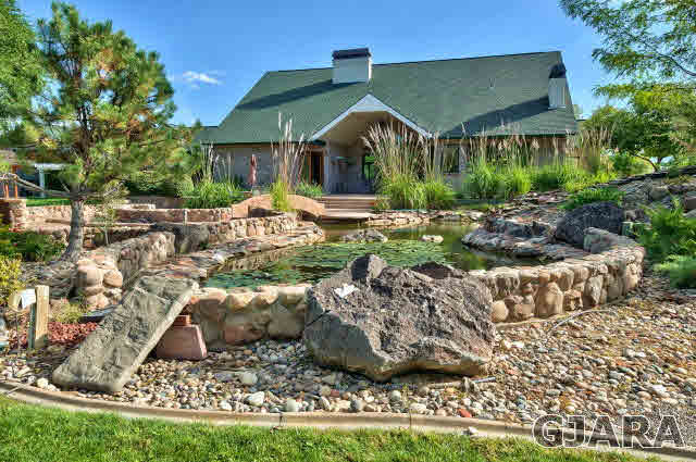 887 25 Road Grand Junction, CO 81505 - Photo 34 of 42 a view of a house with yard and sitting area