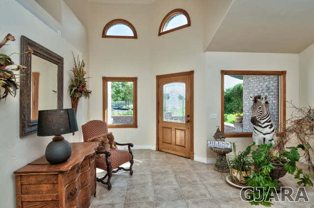887 25 Road Grand Junction, CO 81505 - Photo 6 of 42 a living room with furniture and a window