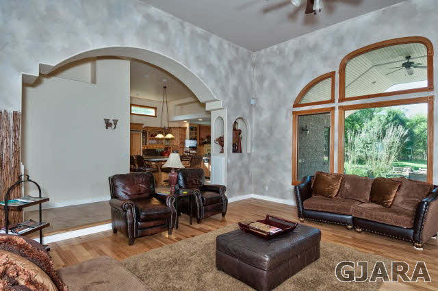887 25 Road Grand Junction, CO 81505 - Photo 8 of 42 a living room with furniture and a large window