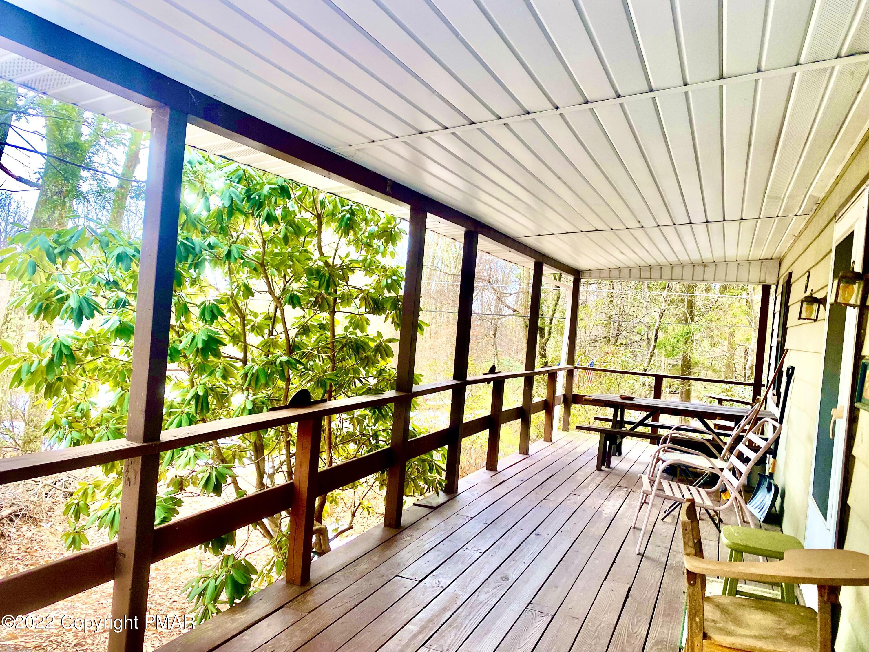 1408 Upper Valley Road Effort, PA 18330 - Photo 4 of 13 a view of a balcony with wooden floor