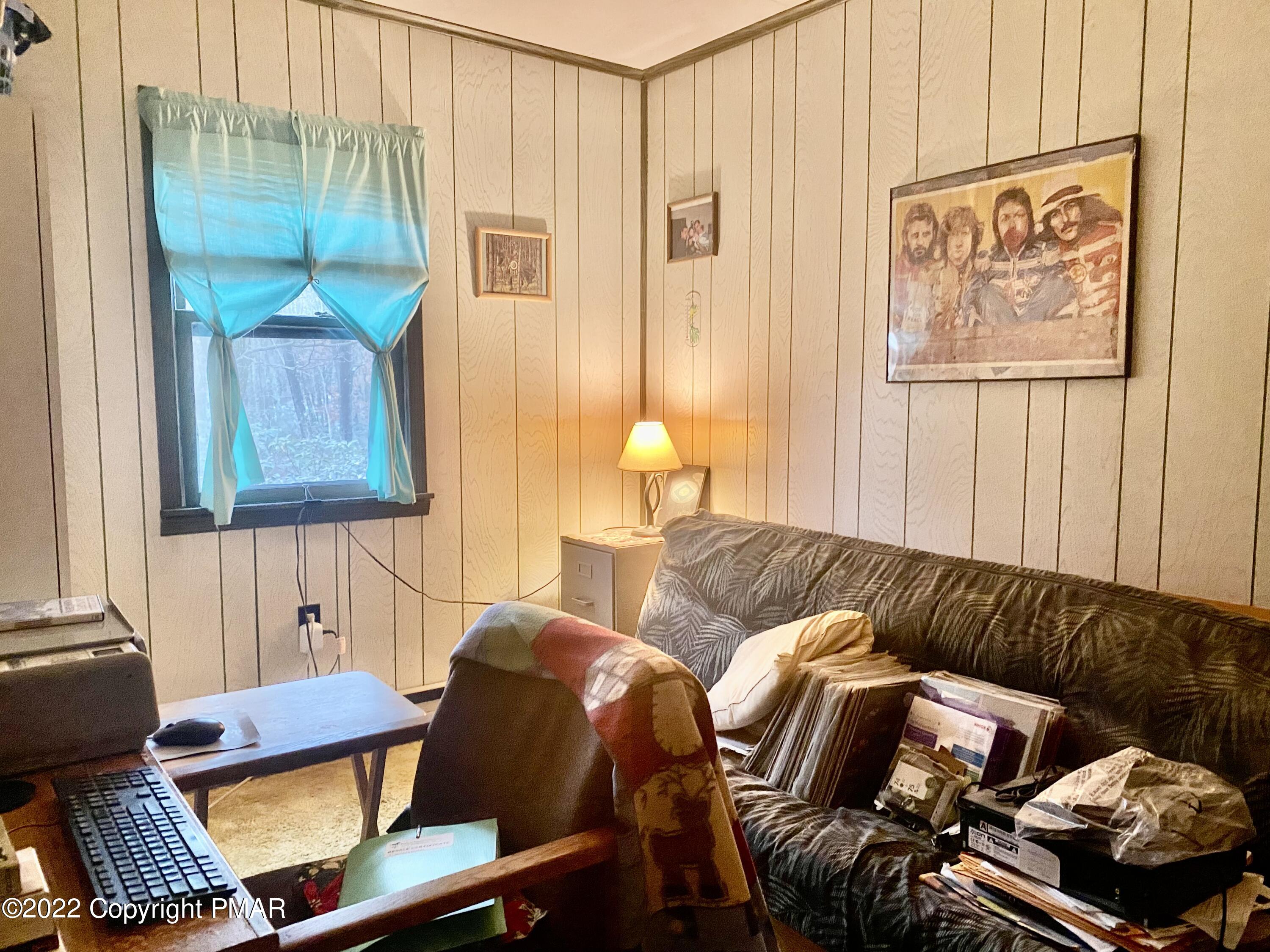 1408 Upper Valley Road Effort, PA 18330 - Photo 10 of 13 a living room with furniture and a window
