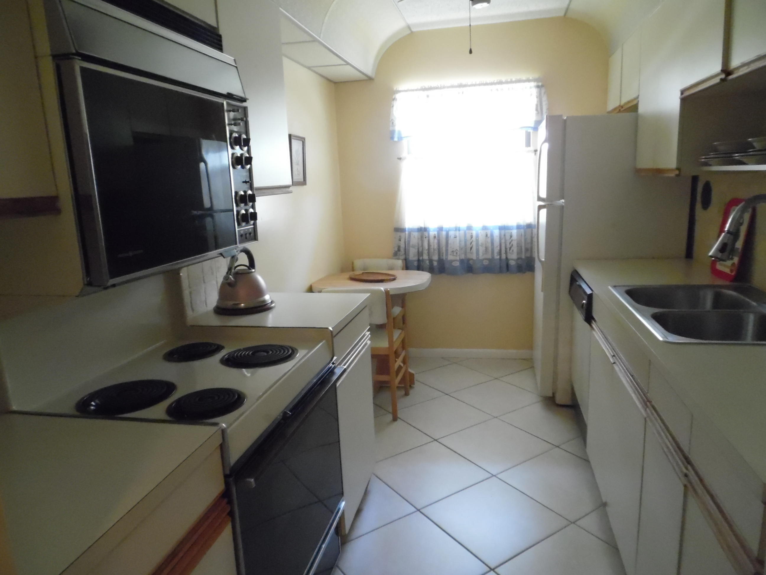 13950 Nesting Way, Unit B Delray Beach, FL 33484 - Photo 7 of 22 Galley Style Kitchen