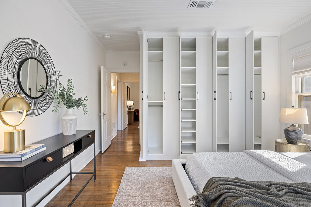 3808 Avenue F Austin, TX 78751 - Photo 14 of 22 a spacious bedroom with a bed a mirror and a window