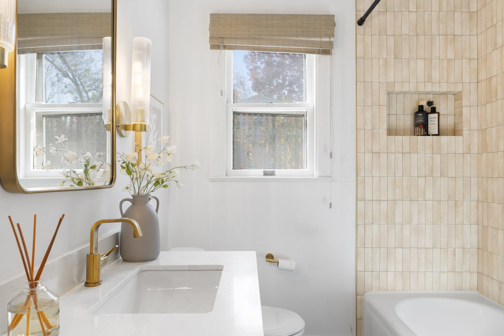 3808 Avenue F Austin, TX 78751 - Photo 15 of 22 a bathroom with a sink a toilet and shower
