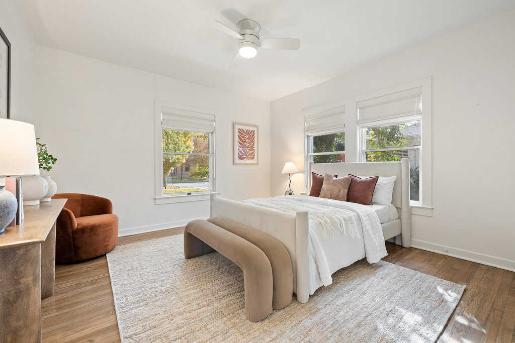 3808 Avenue F Austin, TX 78751 - Photo 17 of 22 a spacious bedroom with a large bed and a window