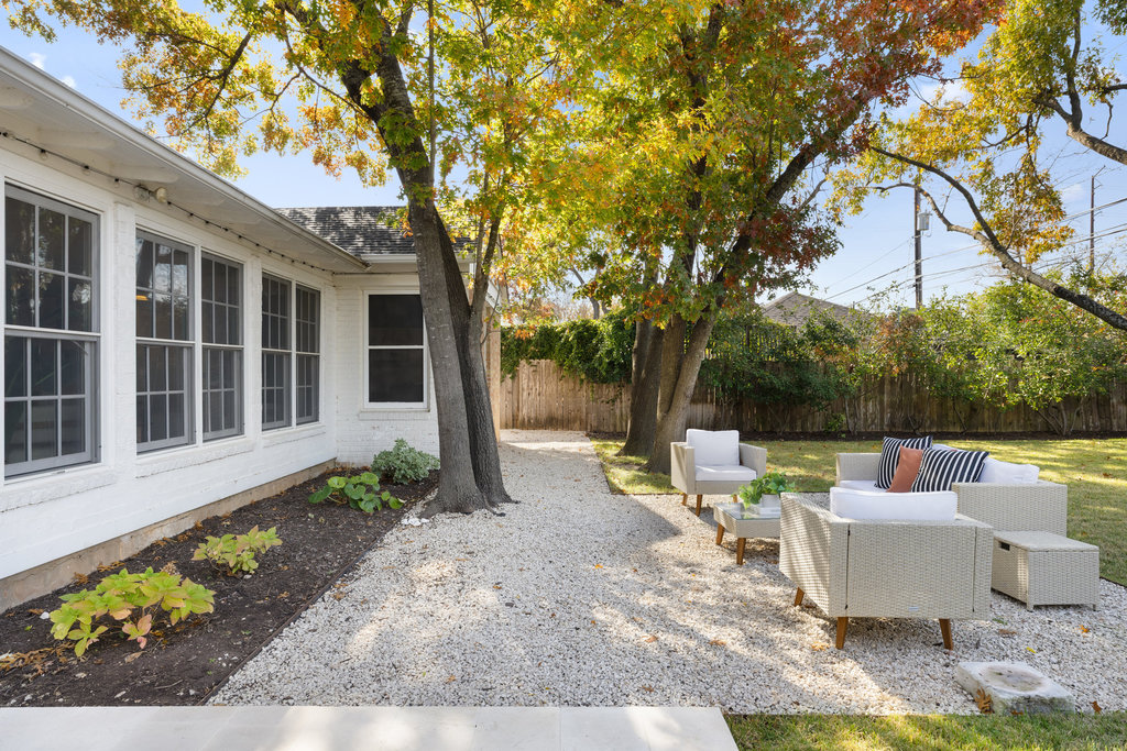 3808 Avenue F Austin, TX 78751 - Photo 20 of 22 Fenced backyard with a patio and an outdoor hangout area