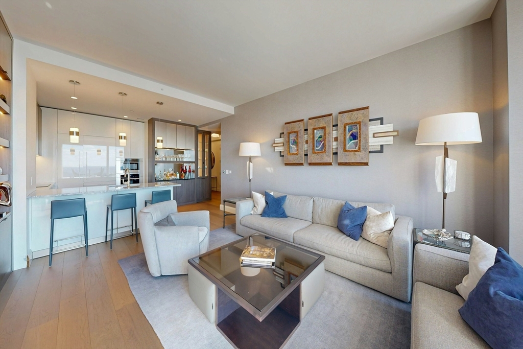 240 Devonshire Street, Unit 4505 Boston, MA 02110 - Photo 17 of 42 a living room with furniture and a table