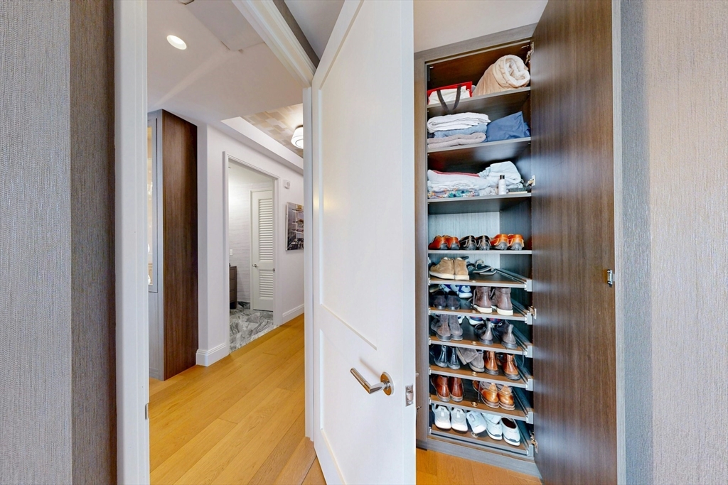 240 Devonshire Street, Unit 4505 Boston, MA 02110 - Photo 22 of 42 a view of a living room with clothes and shoes