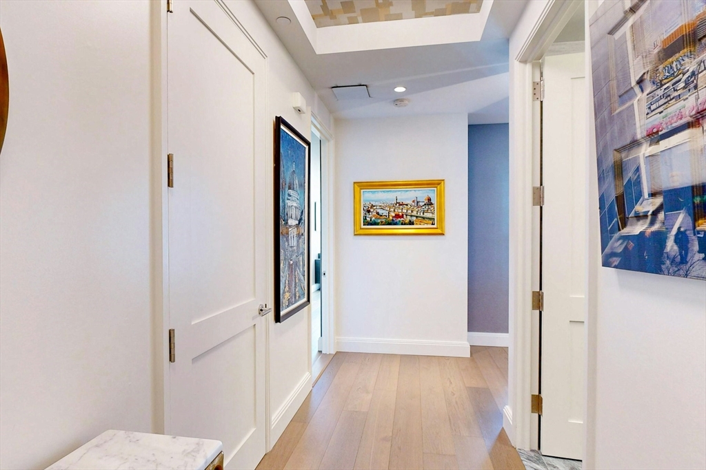 240 Devonshire Street, Unit 4505 Boston, MA 02110 - Photo 24 of 42 a view of a hallway with wooden floor and closet