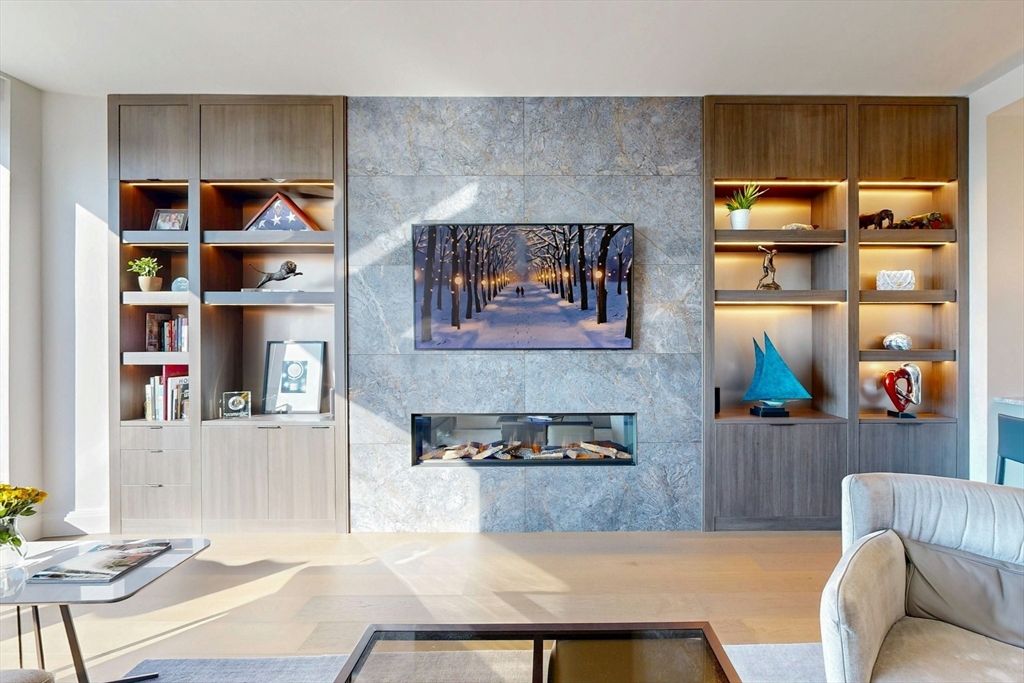 240 Devonshire Street, Unit 4505 Boston, MA 02110 - Photo 3 of 42 a living room with furniture and a kitchen view