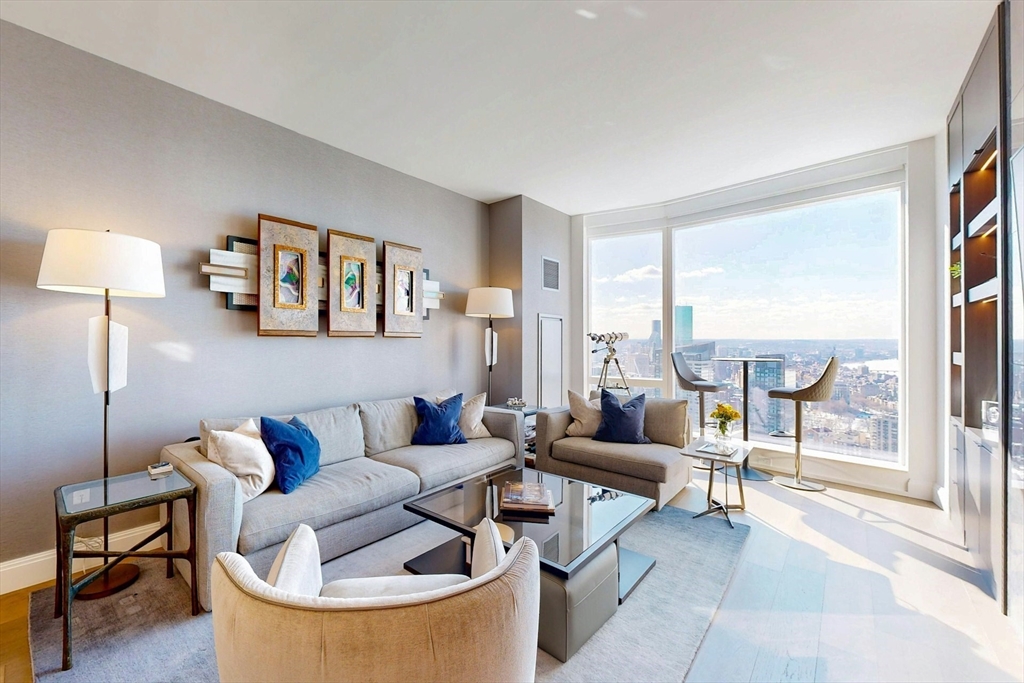 240 Devonshire Street, Unit 4505 Boston, MA 02110 - Photo 4 of 42 a living room with furniture and a large window