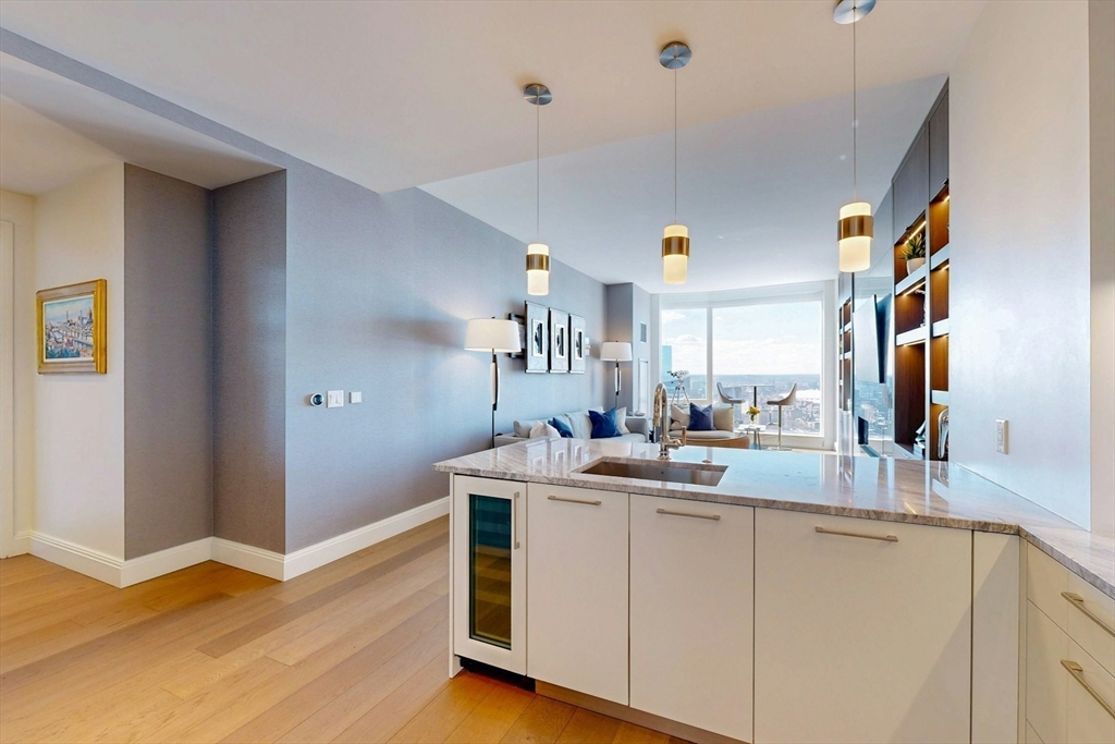 240 Devonshire Street, Unit 4505 Boston, MA 02110 - Photo 10 of 42 a kitchen with a sink and cabinets