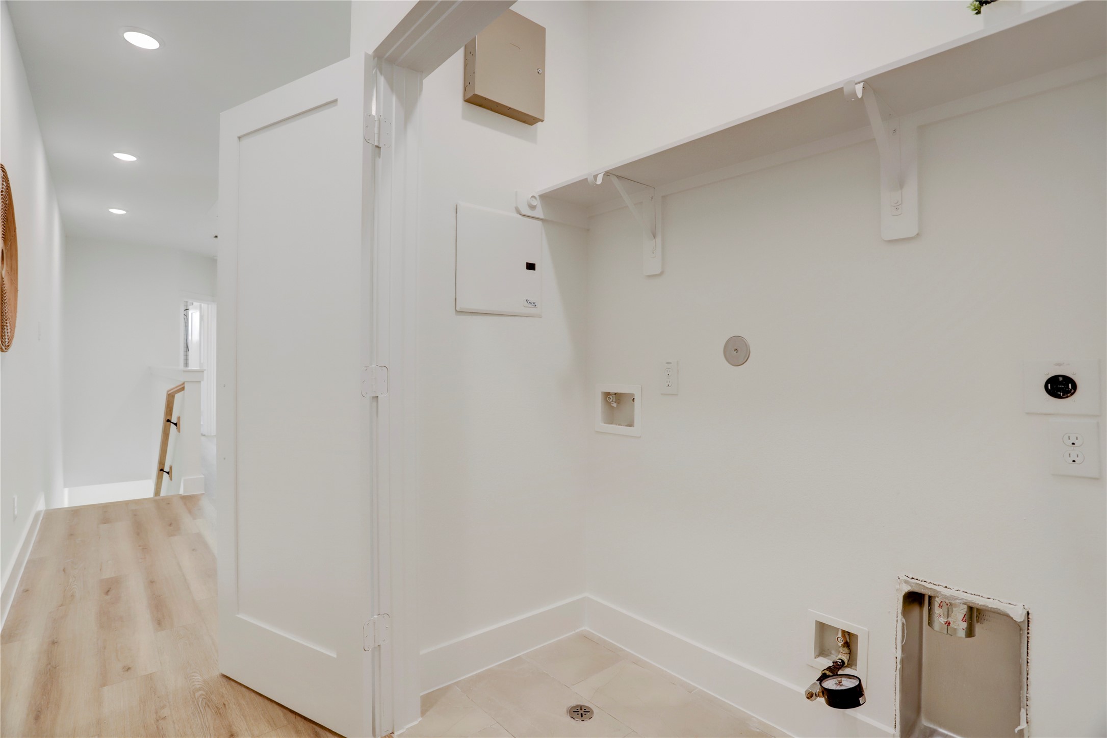 311 Marcella Street, Unit A Houston, TX 77091 - Photo 28 of 34 The utility room on the 2nd floor has hook ups for full sized side-by-side washer and dryer.