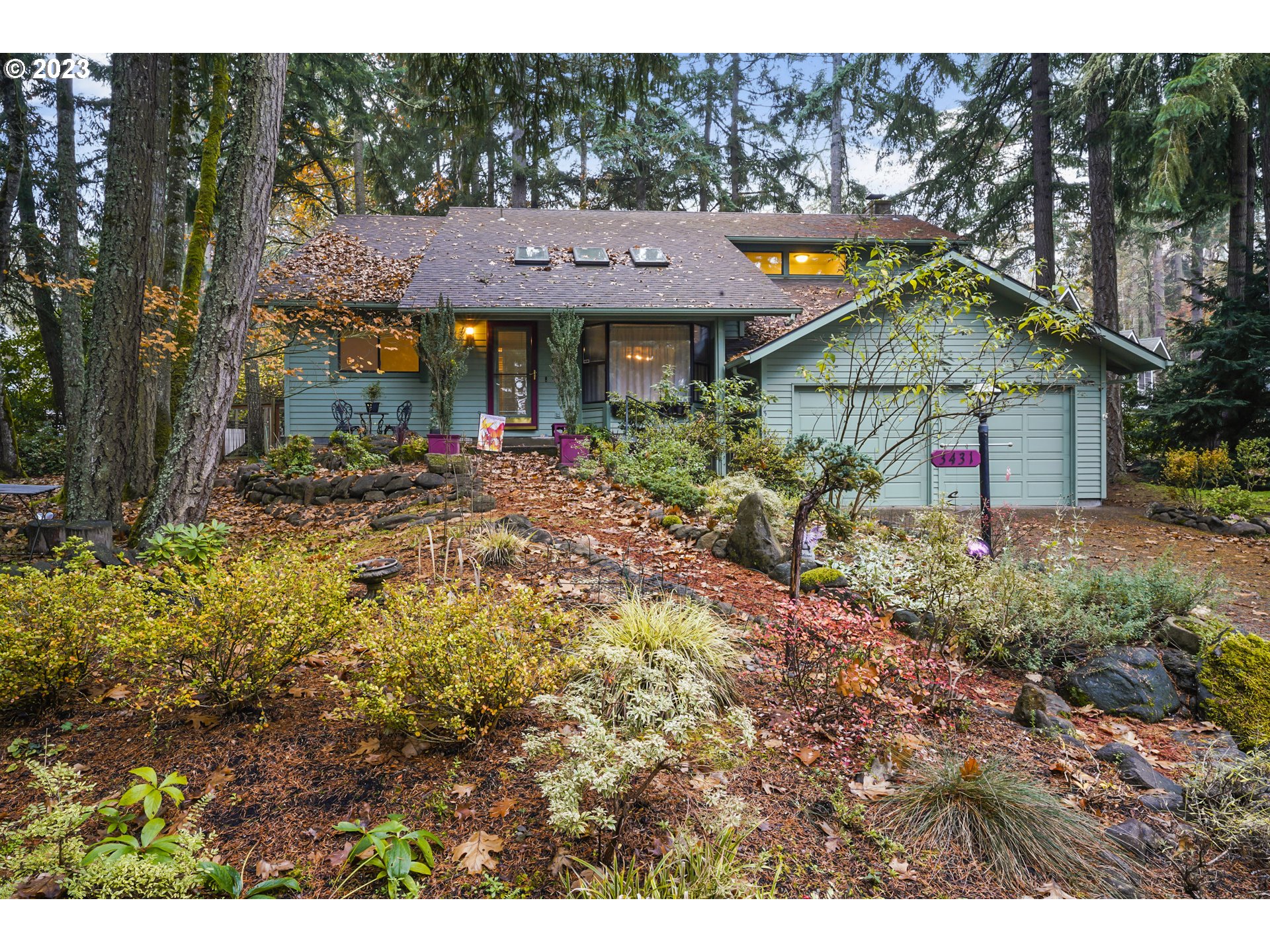3431 Timberline Drive Eugene, OR 97405 - Photo 1 of 39 a view of a big house with large trees and plants