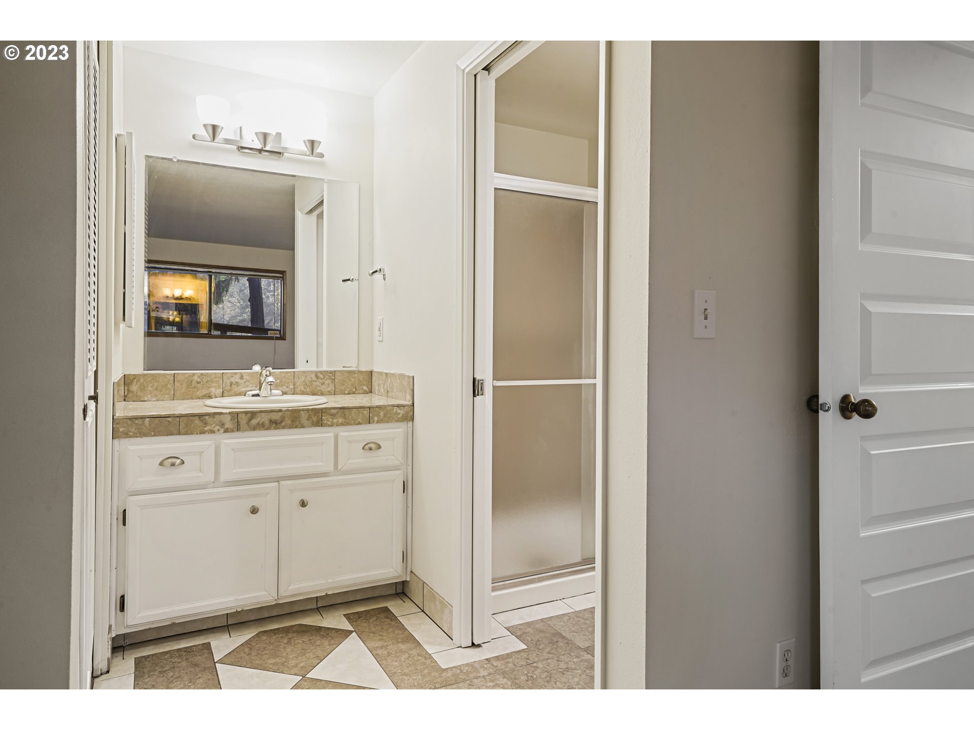 3431 Timberline Drive Eugene, OR 97405 - Photo 12 of 39 a bathroom with a sink and a mirror