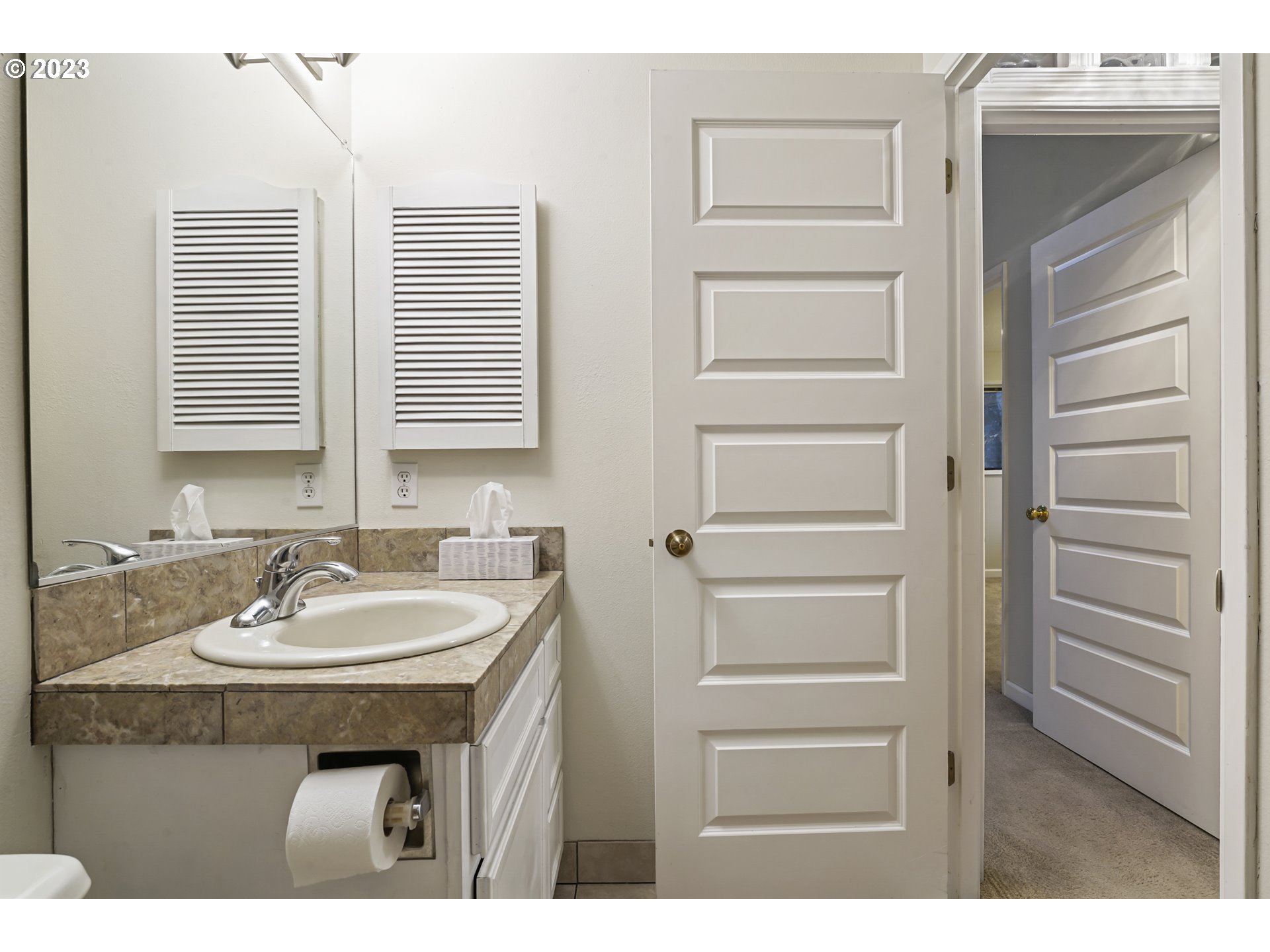 3431 Timberline Drive Eugene, OR 97405 - Photo 14 of 39 a bathroom with a sink and a mirror
