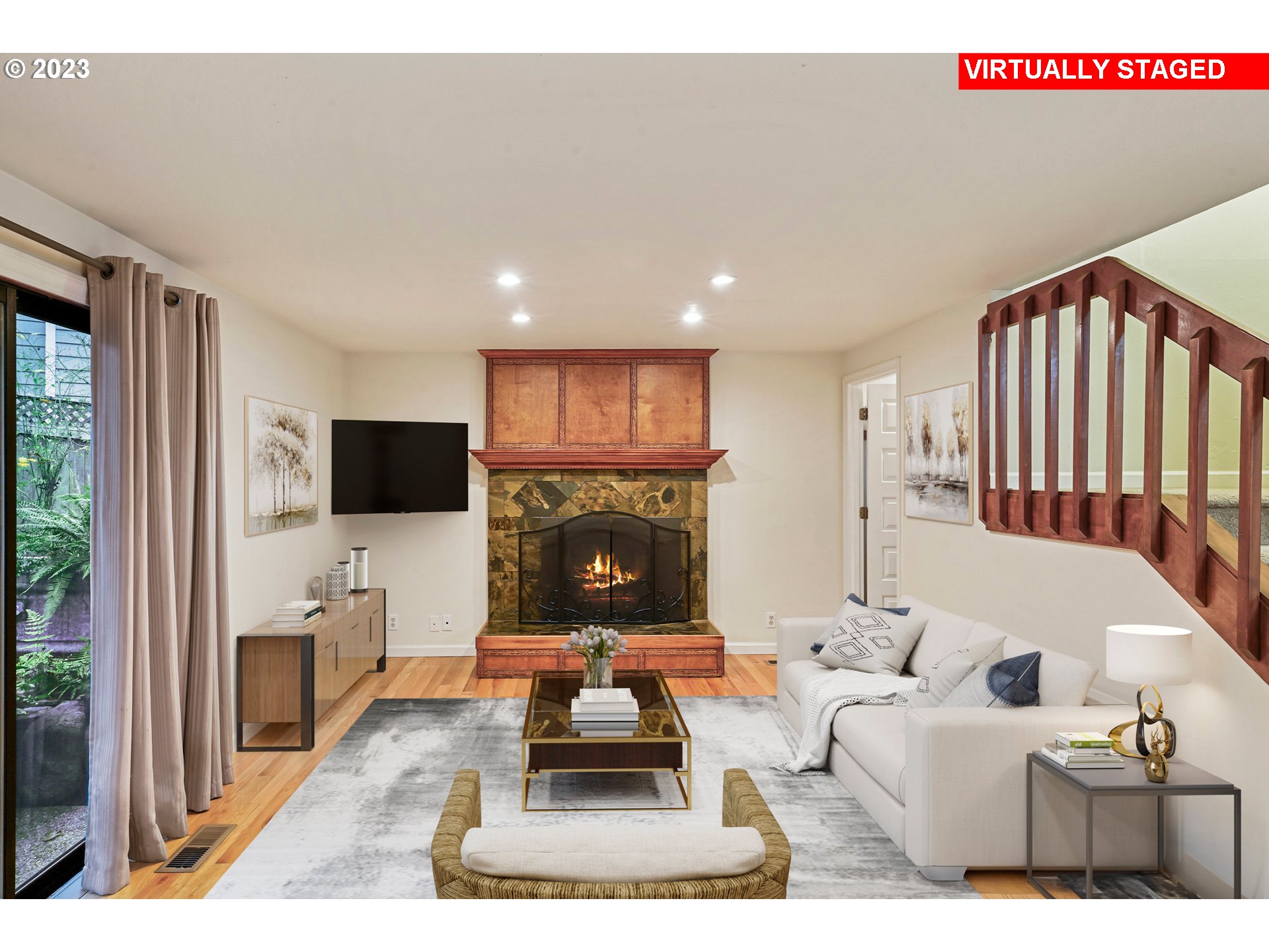 3431 Timberline Drive Eugene, OR 97405 - Photo 15 of 39 a living room with furniture a flat screen tv and a fireplace