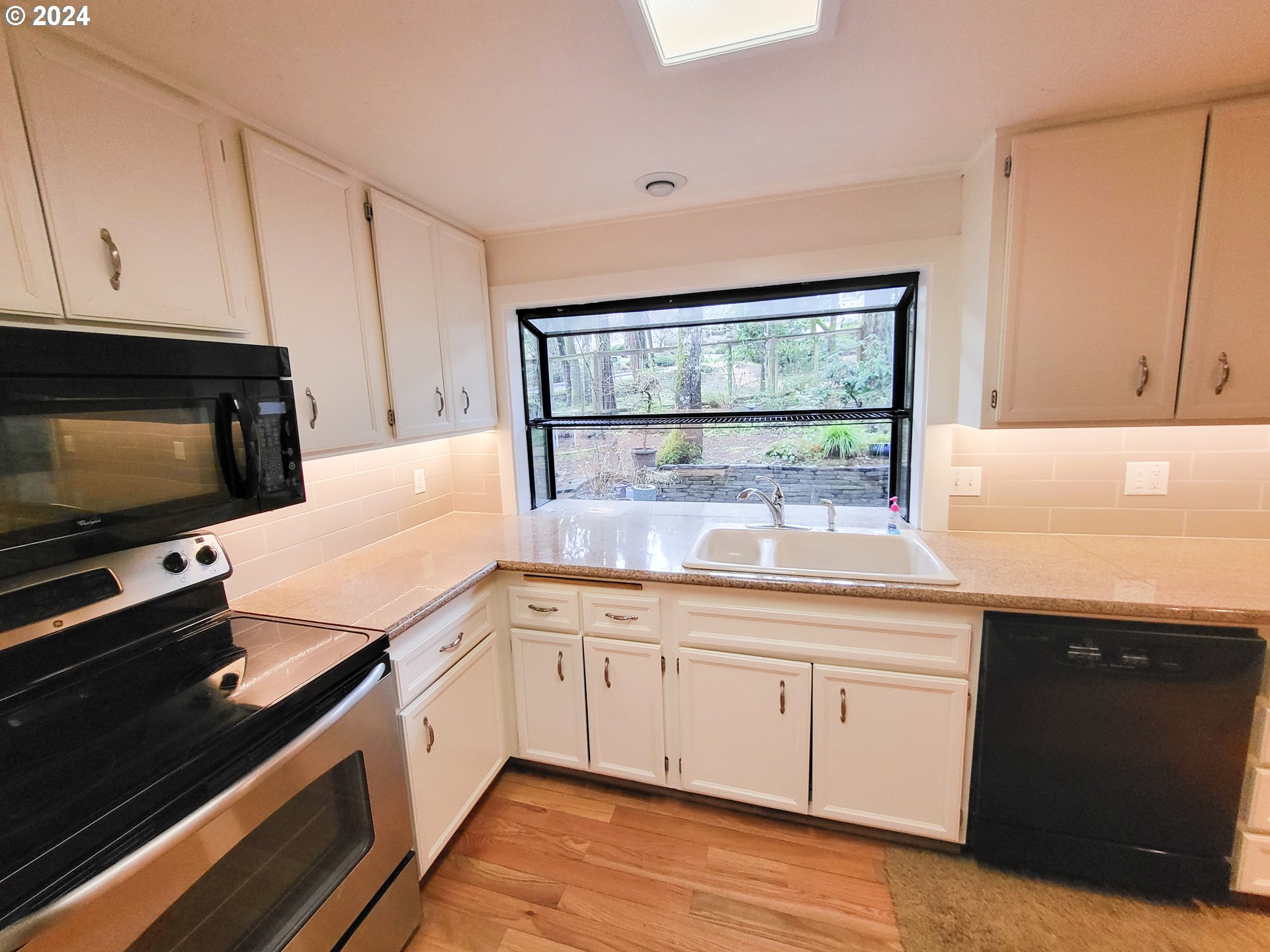 3431 Timberline Drive Eugene, OR 97405 - Photo 17 of 39 a kitchen with a sink and cabinets