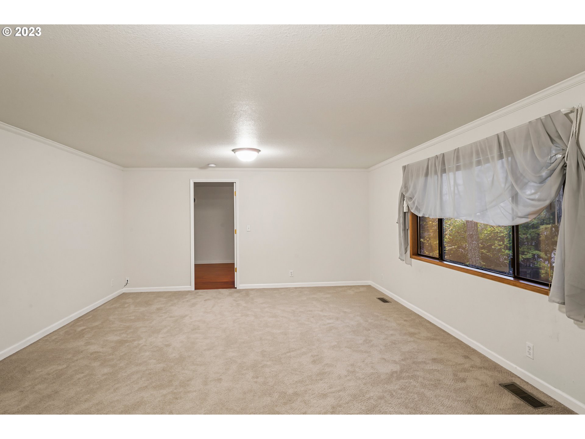 3431 Timberline Drive Eugene, OR 97405 - Photo 28 of 39 a view of an empty room with wooden floor