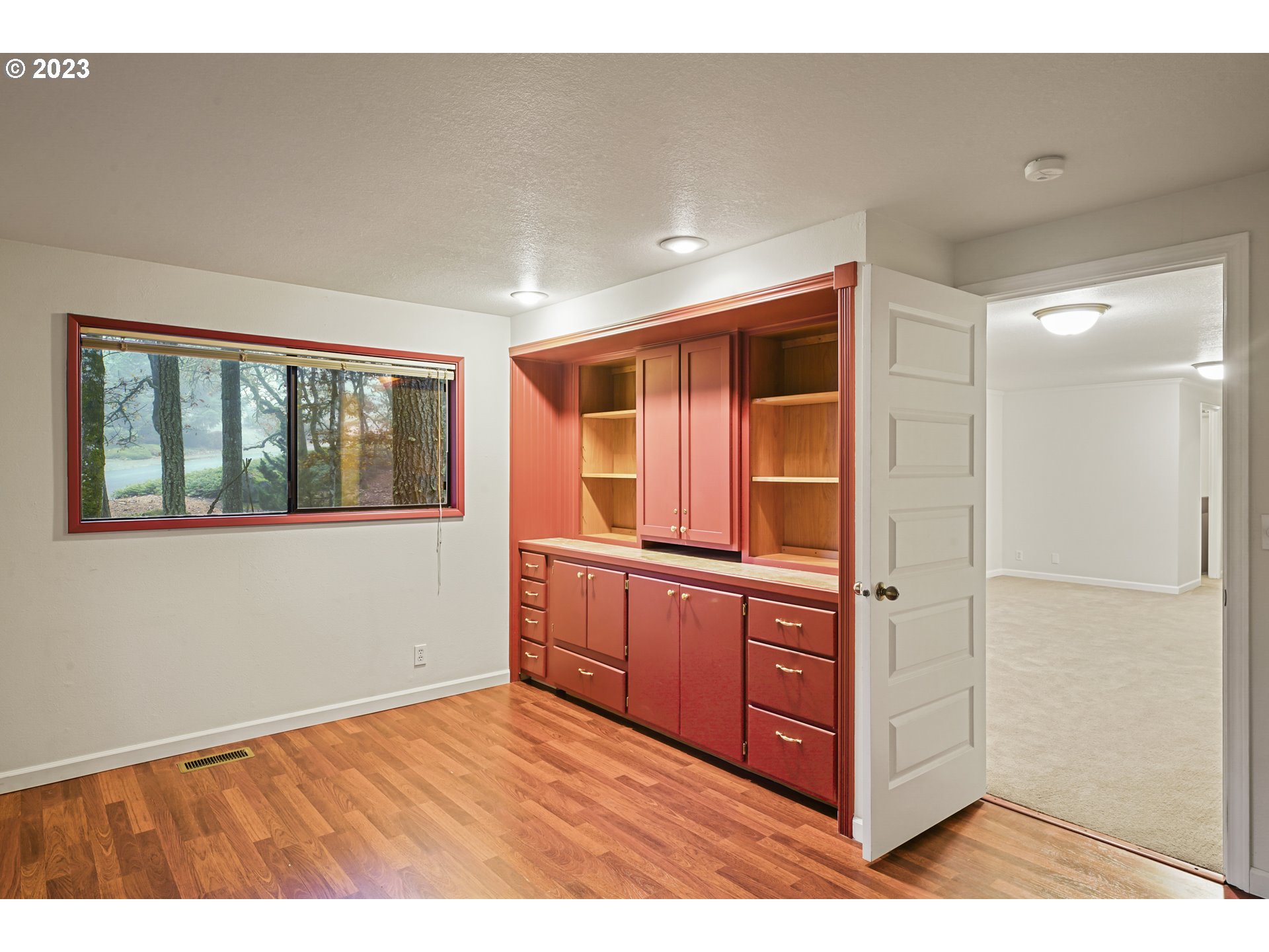 3431 Timberline Drive Eugene, OR 97405 - Photo 30 of 39 a view of an empty room with window and wooden floor