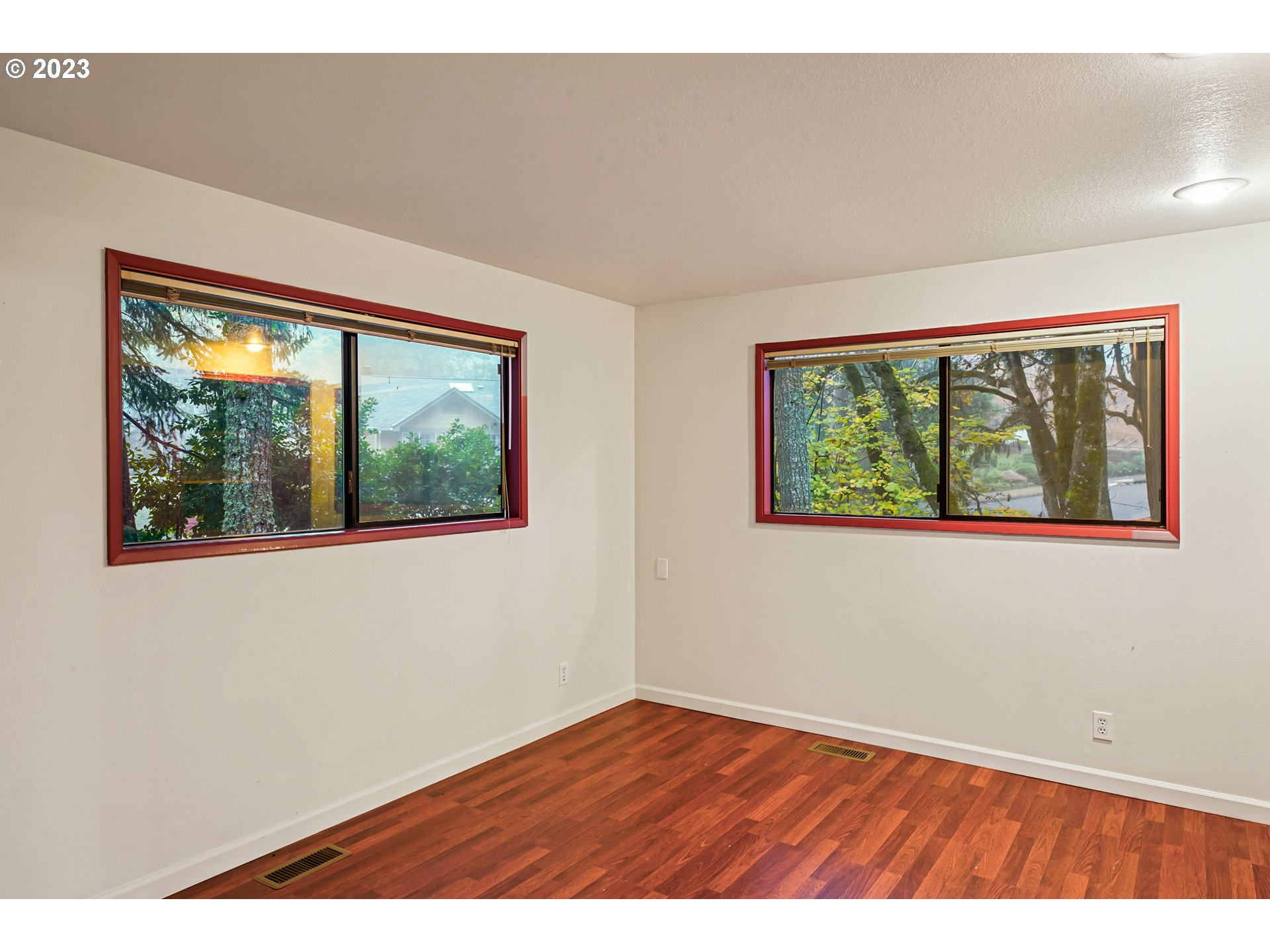 3431 Timberline Drive Eugene, OR 97405 - Photo 31 of 39 a view of an empty room with wooden floor and a window