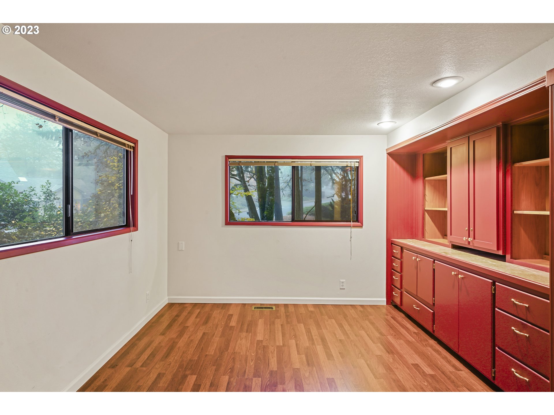 3431 Timberline Drive Eugene, OR 97405 - Photo 32 of 39 a view of an empty room with window and wooden floor