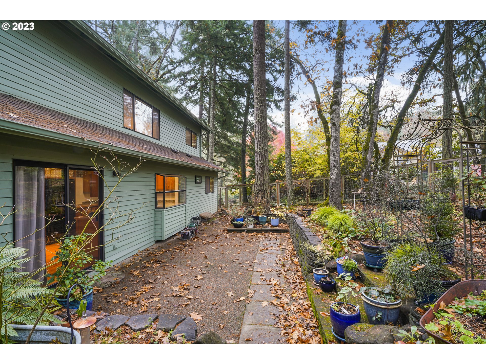 3431 Timberline Drive Eugene, OR 97405 - Photo 35 of 39 a view of a chair and tables in the back yard of the house