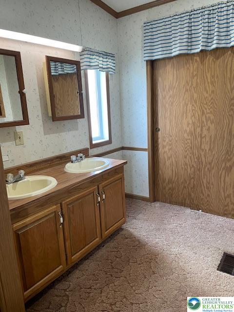 38 De Rose Street Walnutport, PA 18088 - Photo 12 of 27 a bathroom with a double vanity sink and mirror