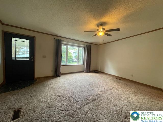 38 De Rose Street Walnutport, PA 18088 - Photo 2 of 27 an empty room with windows and chandelier fan
