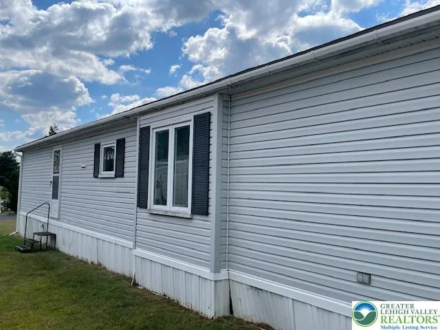 a view of a back yard of the house