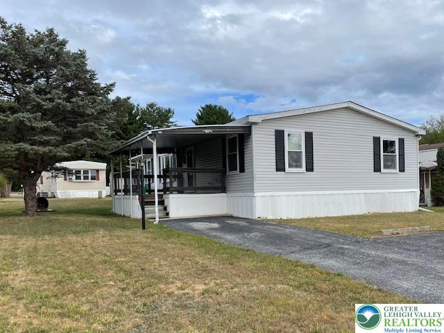 38 De Rose Street Walnutport, PA 18088 - Photo 22 of 27 a view of a house with backyard and trees