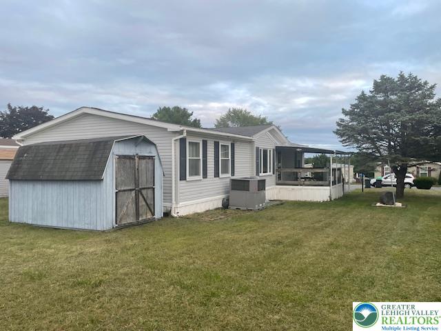 38 De Rose Street Walnutport, PA 18088 - Photo 24 of 27 a front view of a house with a garden and trees
