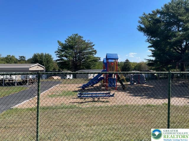 38 De Rose Street Walnutport, PA 18088 - Photo 26 of 27 a view of a swimming pool with a bench