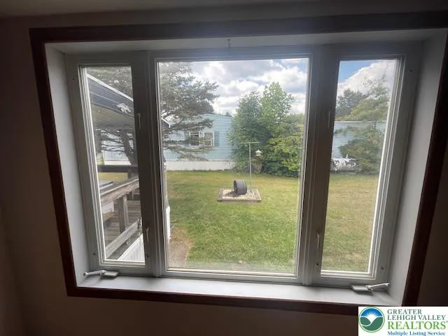 a view of a room that has a large window