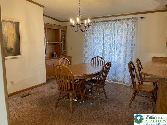 38 De Rose Street Walnutport, PA 18088 - Photo 6 of 27 a view of a dining room with furniture and chandelier