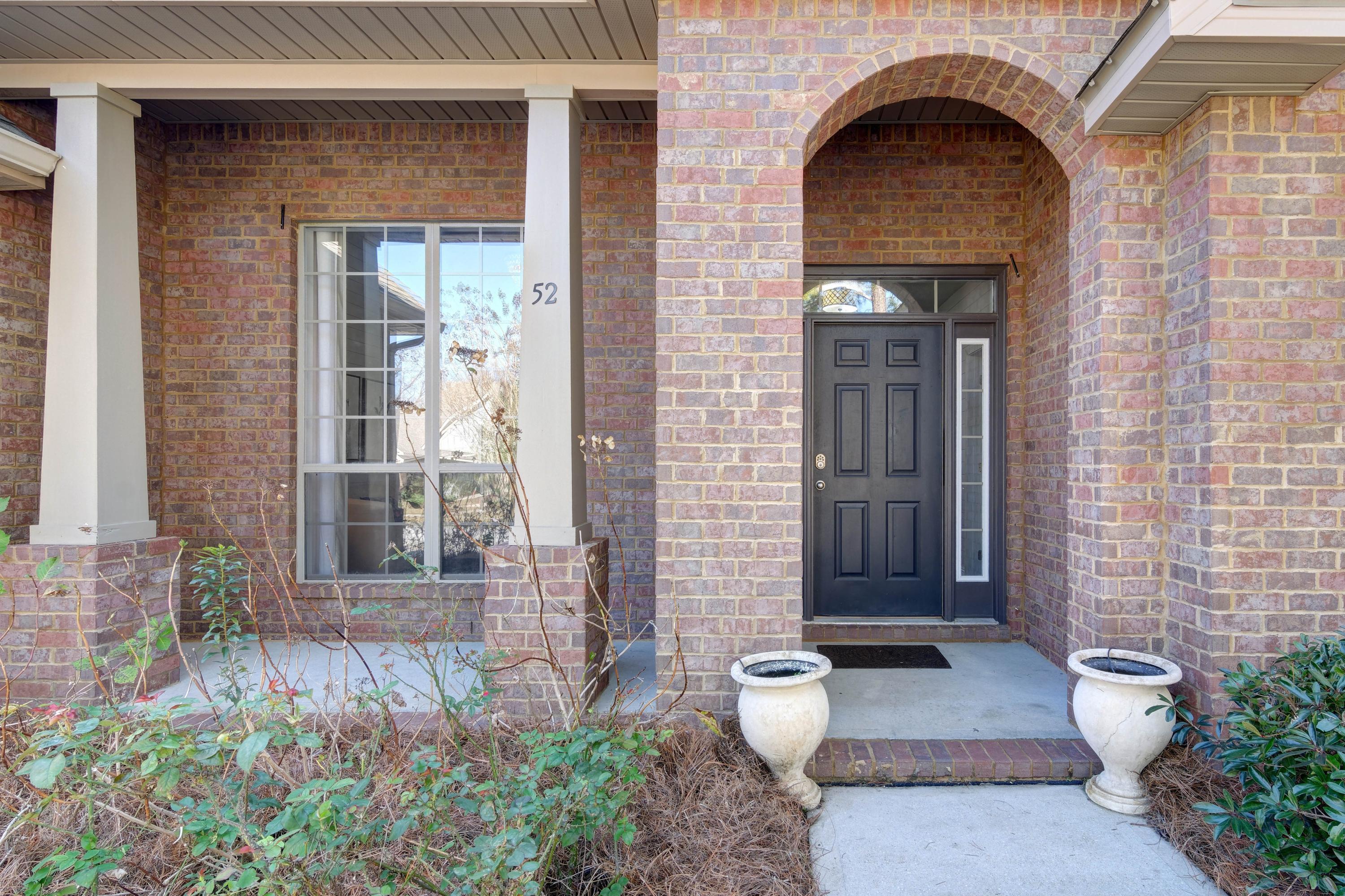 52 Mango Lane Freeport, FL 32439 - Photo 2 of 69 a front view of a house with garden