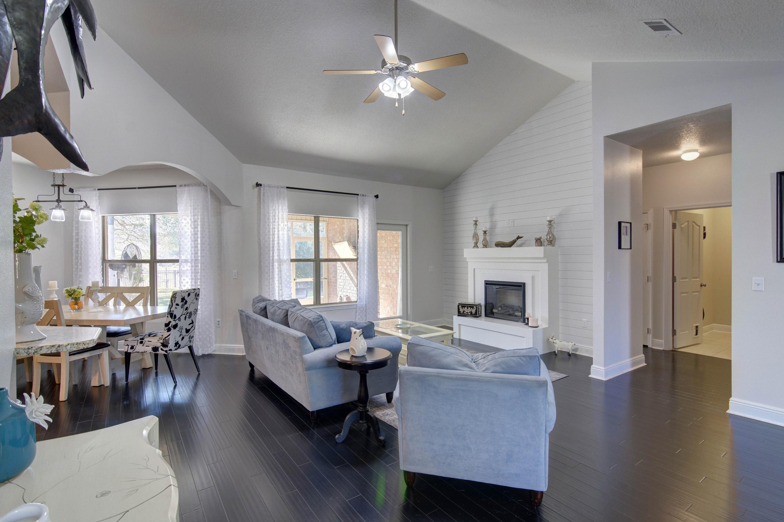 52 Mango Lane Freeport, FL 32439 - Photo 11 of 69 a living room with fireplace furniture and a wooden floor