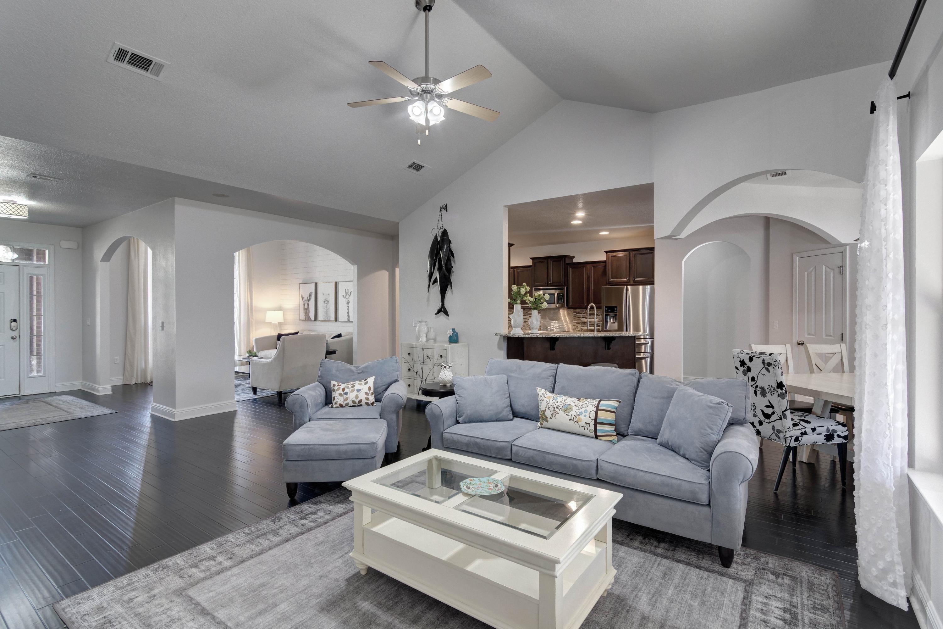 52 Mango Lane Freeport, FL 32439 - Photo 13 of 69 a living room with furniture and a chandelier