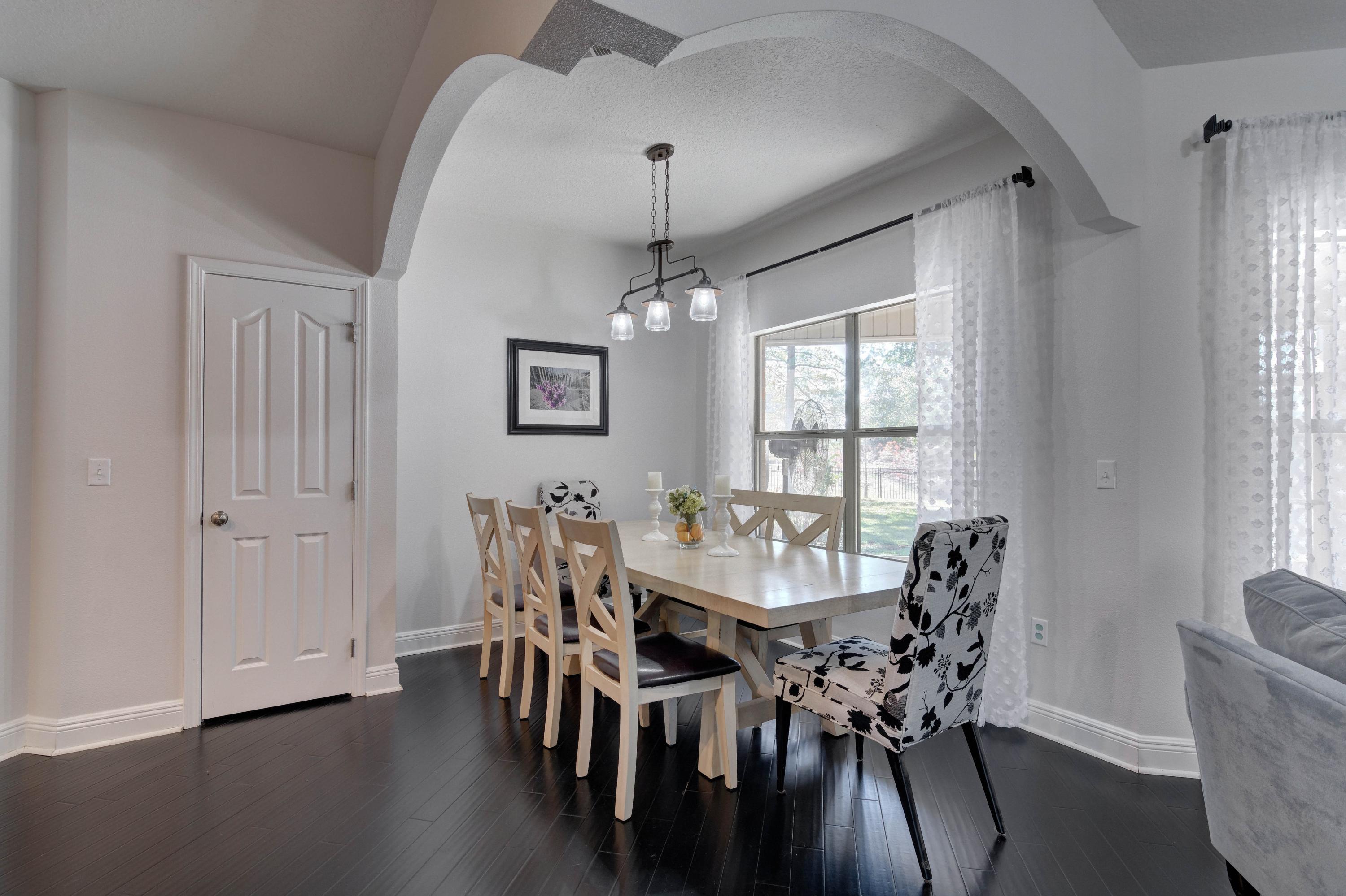 52 Mango Lane Freeport, FL 32439 - Photo 15 of 69 a view of a dining room with furniture window and wooden floor